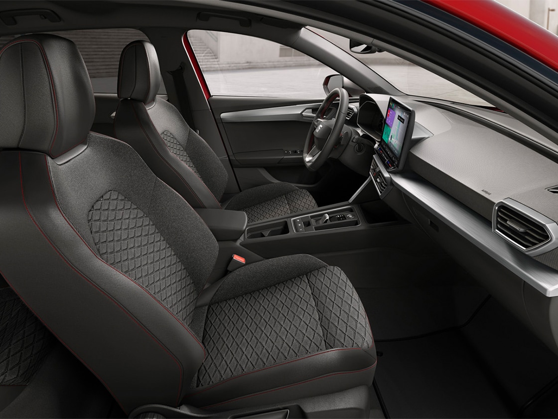 Interior view of SEAT Leon featuring FR cloth comfort seats, combining ergonomic support and stylish design for a comfortable journey.