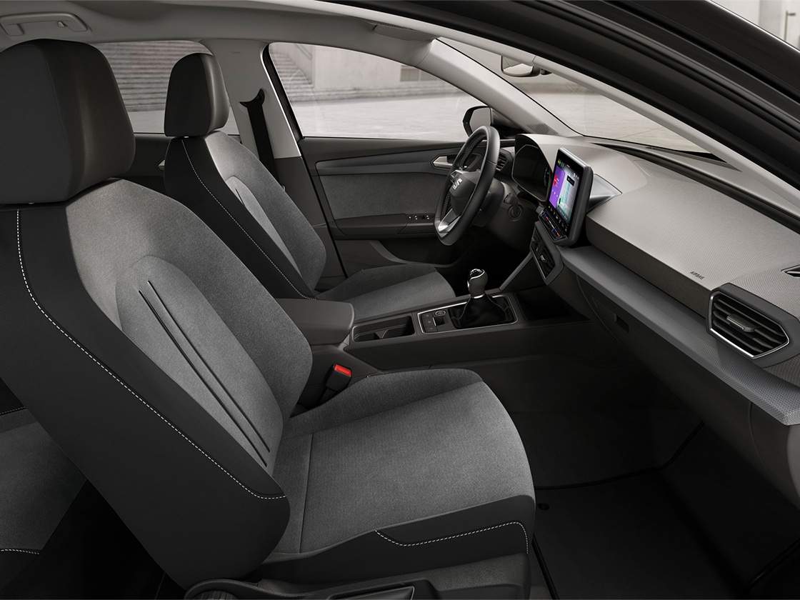 Interior view of SEAT Leon featuring cloth comfort seats, offering a relaxed and practical driving experience.