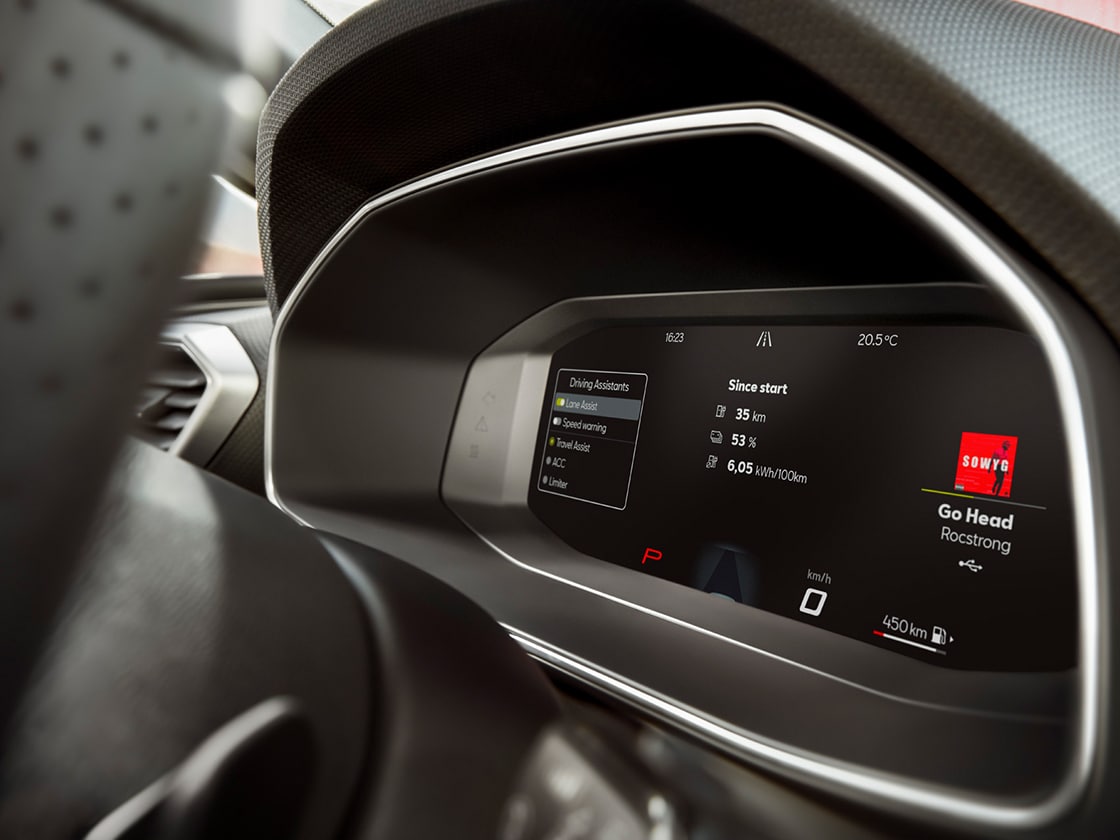 Interior view of the seat leon 2025's digital dashboard, compatible with wireless apple carplay and carplay android auto, allong with lane assist and advanced driving aids.