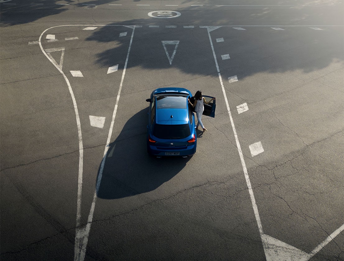 woman entering the seat ibiza sapphire blue