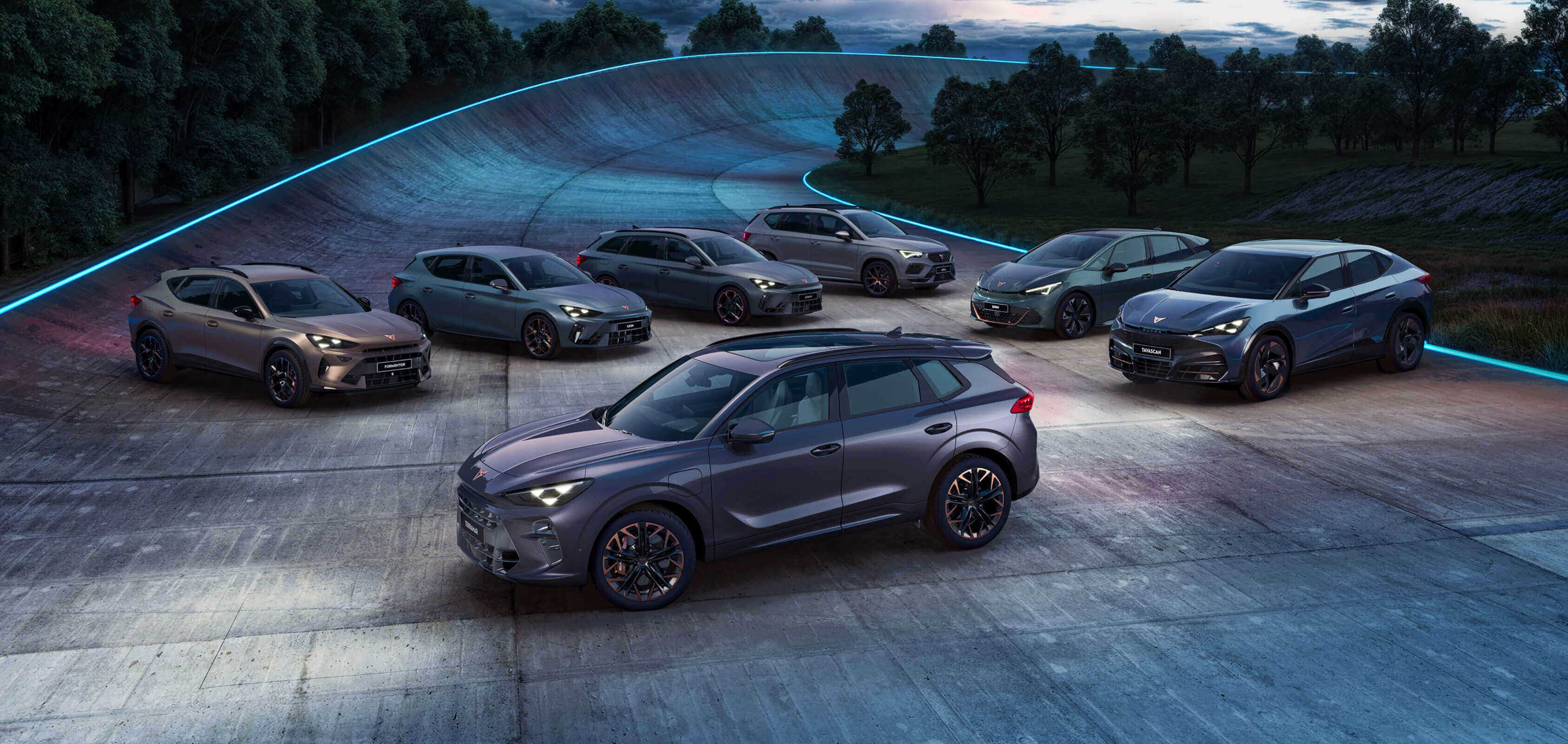 Seven CUPRA cars parked in a curved racing circuit, surrounded by bushes with dimmed lights and the sundown on the background.