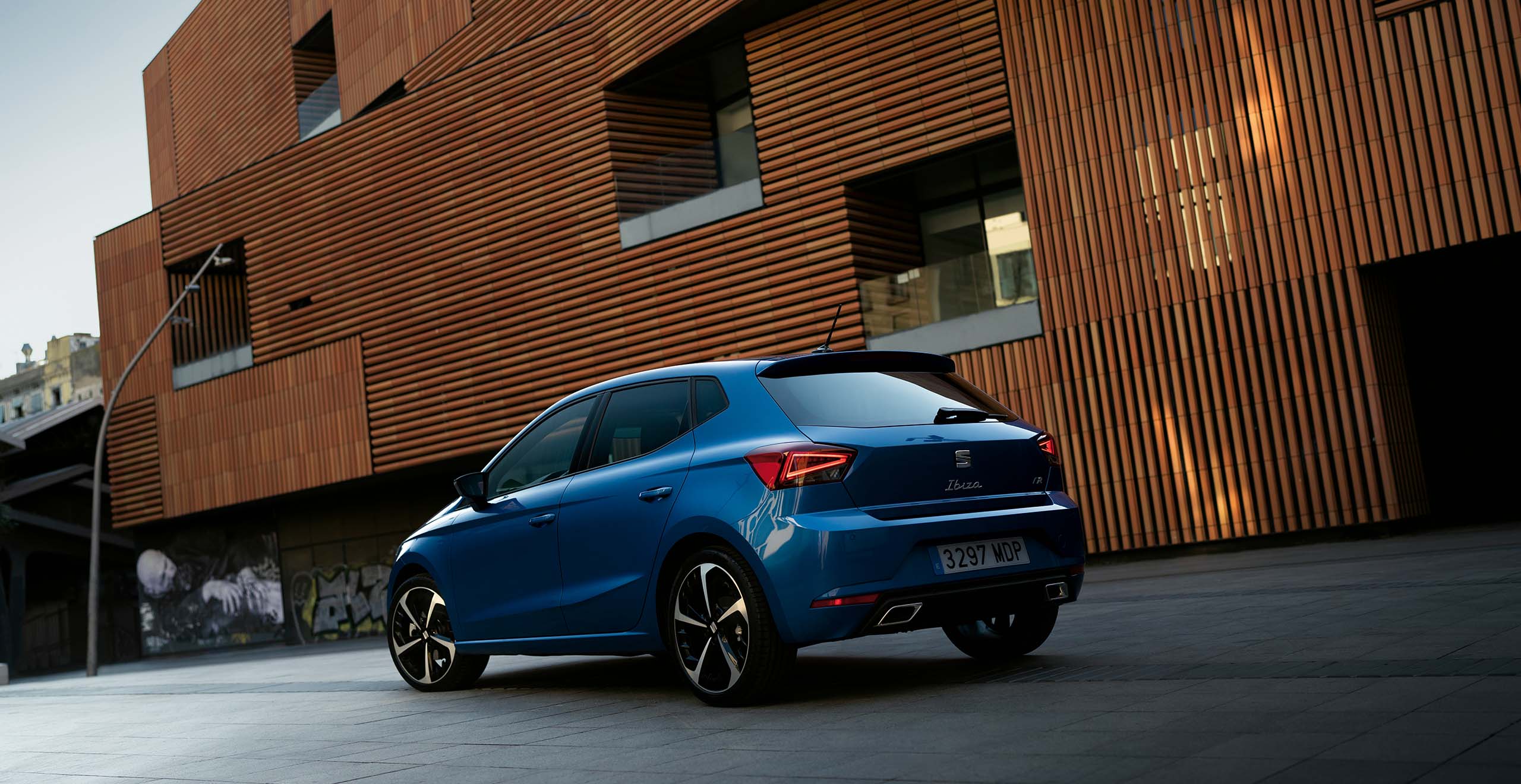 Two SEAT Ibiza parked, one Sapphire Blue colour and another Desire Red colour.